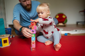 Father and daughter building a tower