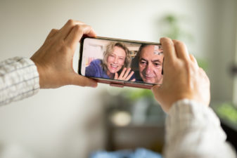 Person having video call with parents